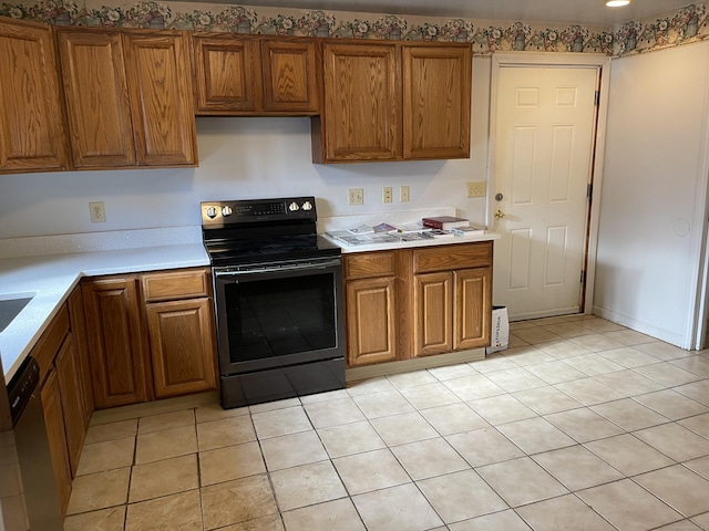 kitchen featuring light tile patterned floors and appliances with stainless steel finishes