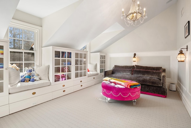 recreation room with vaulted ceiling, carpet floors, and a chandelier