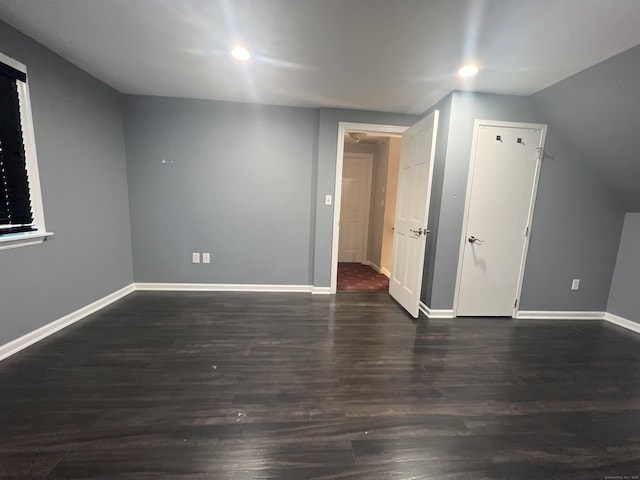 bonus room with dark hardwood / wood-style flooring