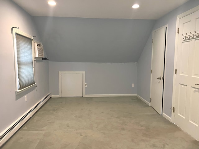 bonus room featuring light carpet, a wall unit AC, baseboard heating, and lofted ceiling