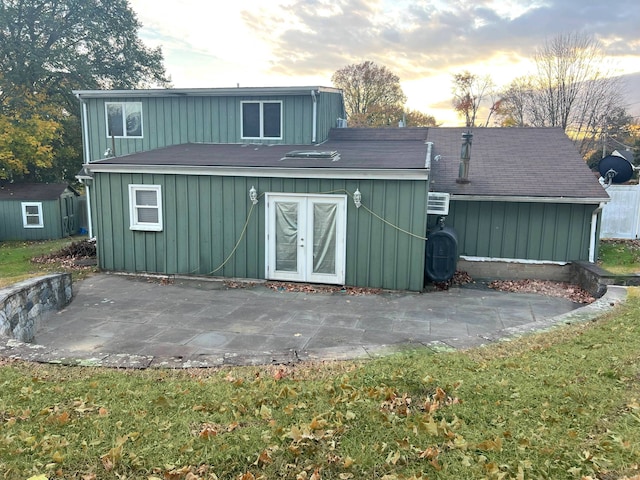 outdoor structure at dusk with french doors