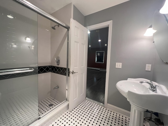 bathroom featuring a shower with door