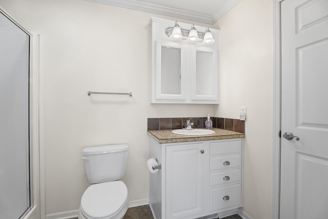 bathroom with vanity, a shower with door, crown molding, tile patterned flooring, and toilet