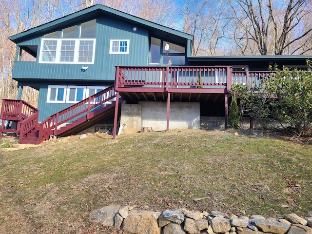 rear view of property with a lawn and a wooden deck