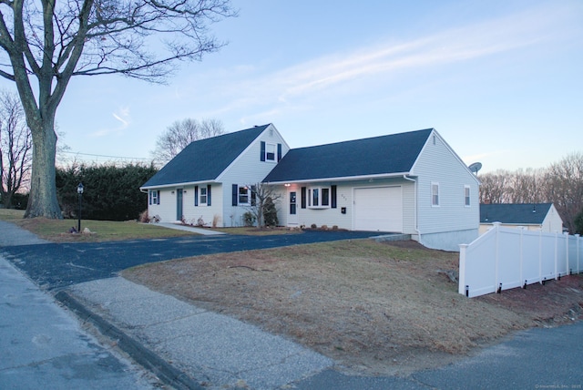 view of front of house featuring a front yard and a garage