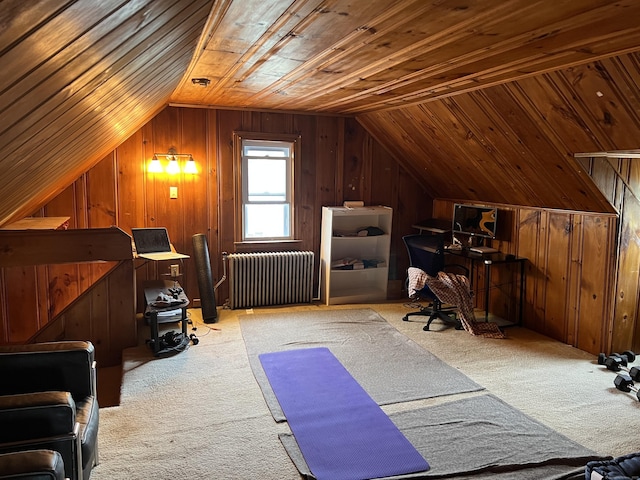 interior space featuring wood walls, radiator heating unit, wood ceiling, and lofted ceiling