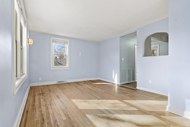 unfurnished room with light wood-type flooring