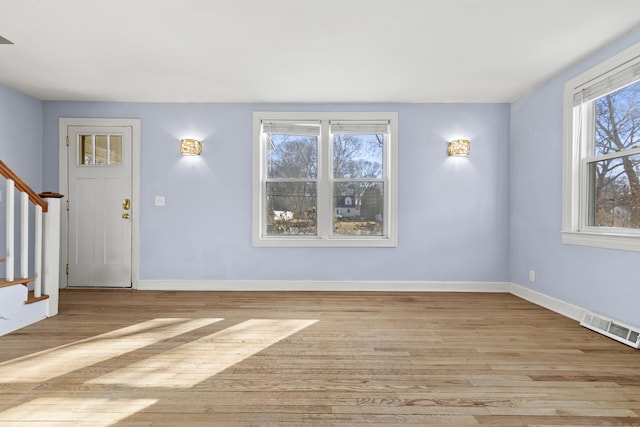 foyer with light hardwood / wood-style floors