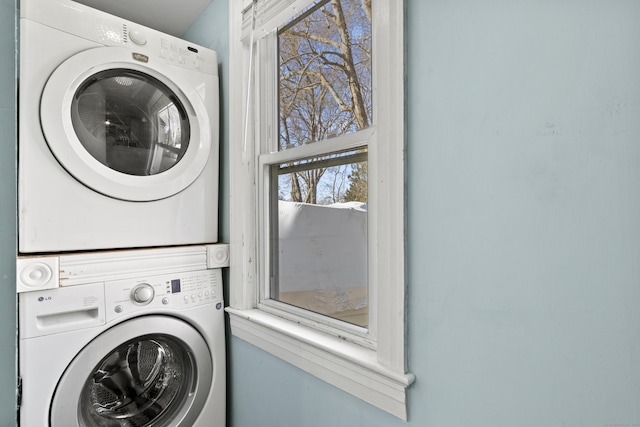 laundry room featuring stacked washing maching and dryer