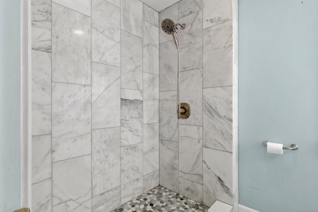 bathroom featuring tiled shower