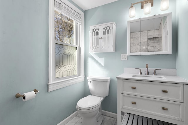 bathroom with toilet and vanity