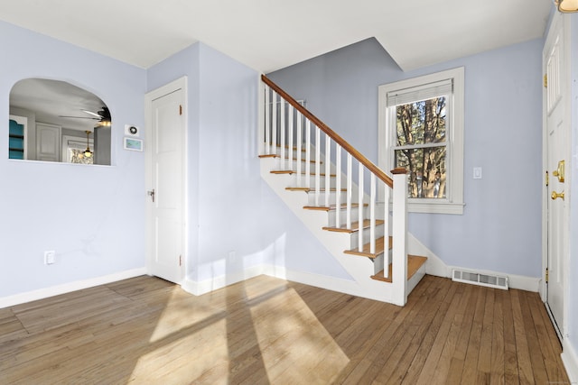 entrance foyer featuring ceiling fan and hardwood / wood-style flooring