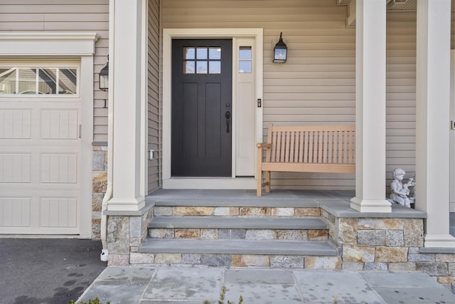 entrance to property featuring a porch