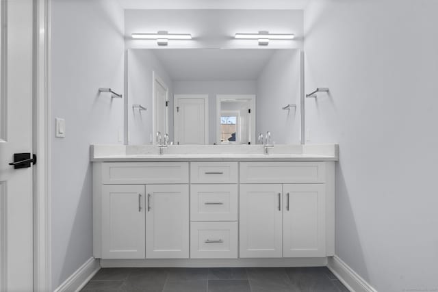 bathroom with tile patterned floors and vanity