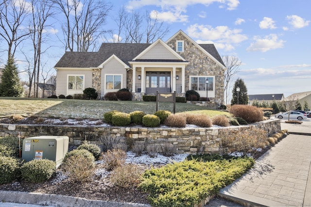 craftsman-style home featuring french doors