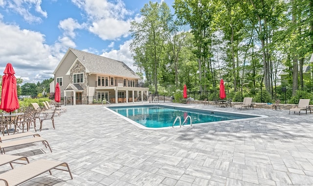 view of swimming pool featuring a patio