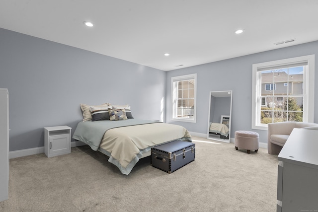 bedroom with light carpet