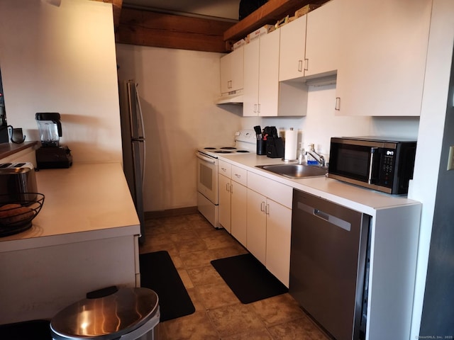 kitchen with white cabinetry, sink, and appliances with stainless steel finishes