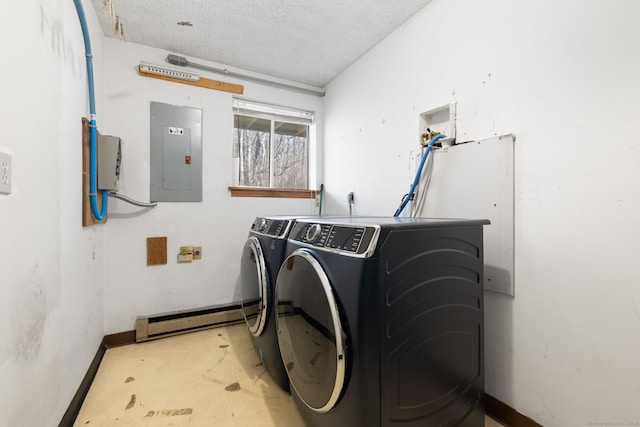 laundry area featuring a baseboard radiator, a textured ceiling, electric panel, and independent washer and dryer