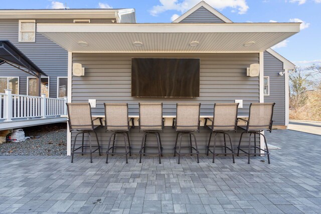 view of patio with outdoor dry bar