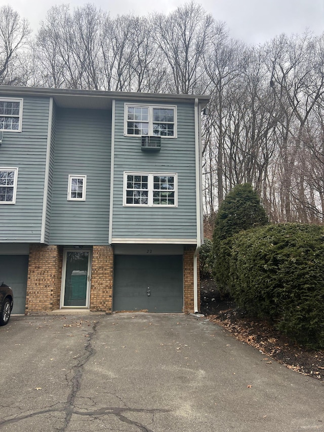 view of side of home featuring a garage