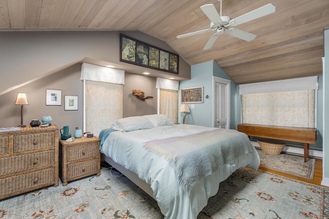 bedroom with ceiling fan, wood ceiling, vaulted ceiling, and light hardwood / wood-style floors