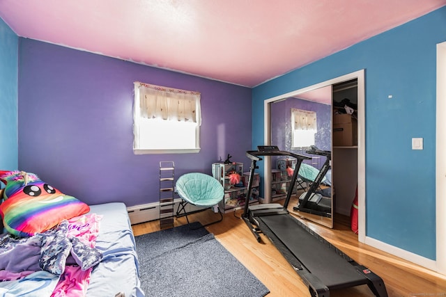 exercise area with wood-type flooring