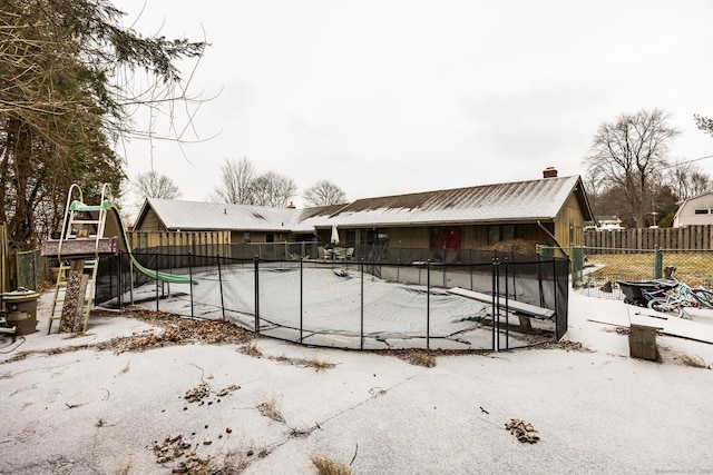 view of snow covered pool