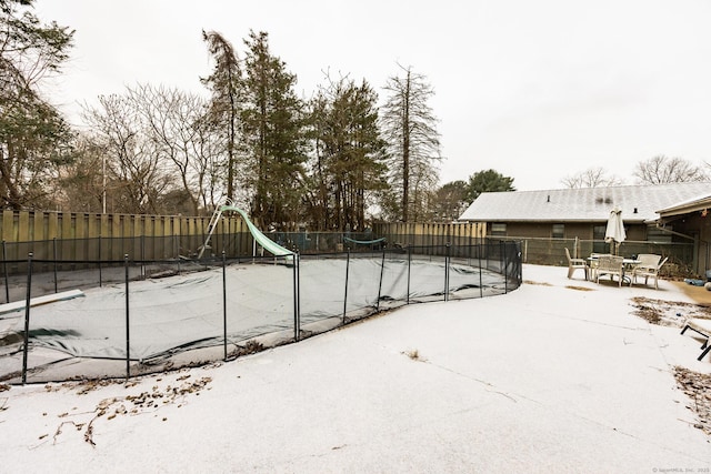 view of snow covered pool