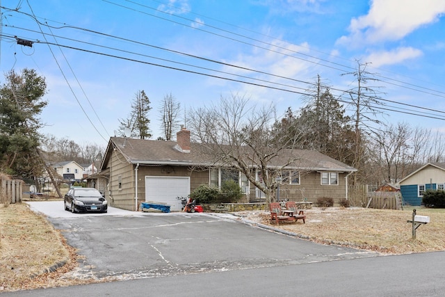 single story home featuring a garage