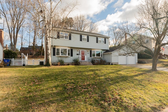 view of front of property with cooling unit, a garage, a front lawn, and an outdoor structure