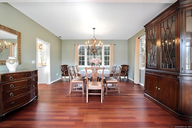 dining room featuring dark hardwood / wood-style floors and a notable chandelier