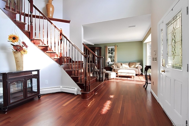 entrance foyer with baseboard heating and wood-type flooring