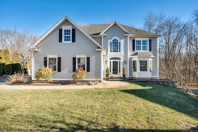 view of property with a front lawn