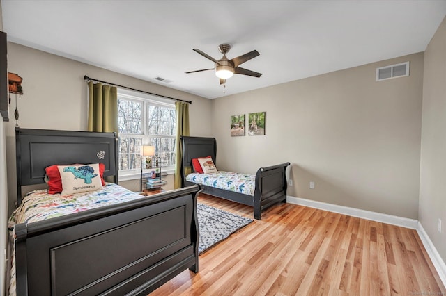 bedroom featuring light wood-type flooring and ceiling fan