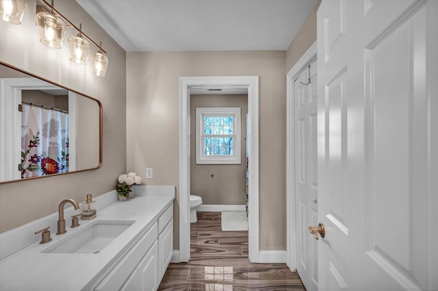 bathroom with vanity and toilet