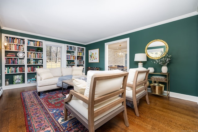 living room with ornamental molding, dark wood-type flooring, and an inviting chandelier