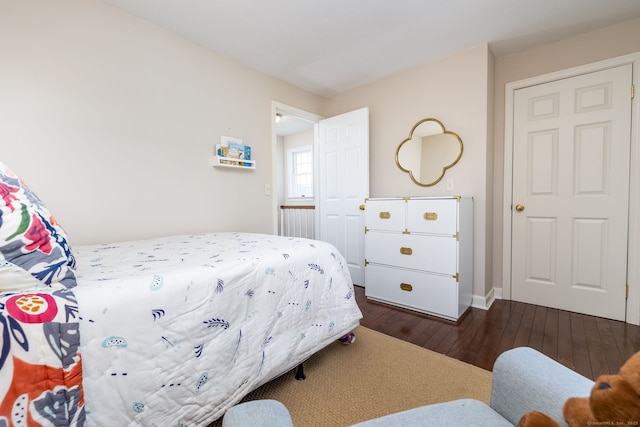 bedroom featuring dark wood-type flooring