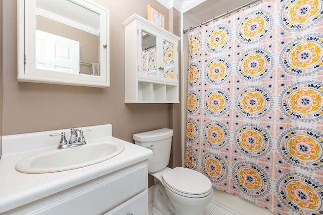 bathroom with ornamental molding, vanity, toilet, and curtained shower