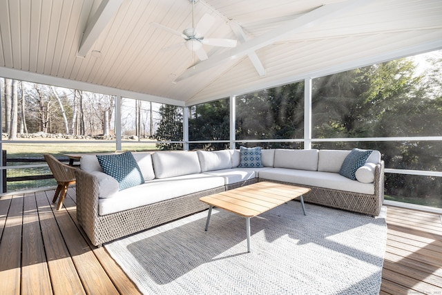 sunroom with vaulted ceiling with beams and ceiling fan