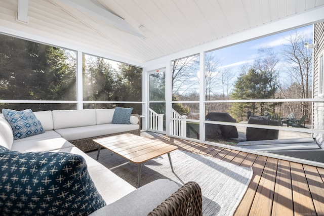 sunroom with vaulted ceiling and plenty of natural light