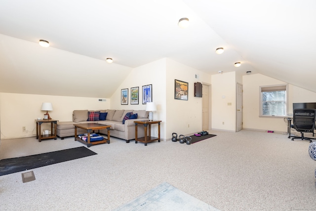 living room featuring vaulted ceiling and carpet