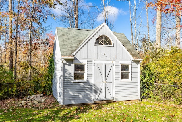 view of outbuilding featuring a lawn