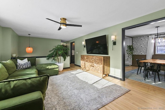 living room featuring hardwood / wood-style flooring and ceiling fan