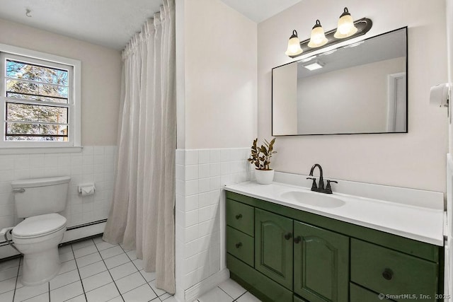 bathroom featuring a baseboard radiator, tile walls, tile patterned floors, and vanity