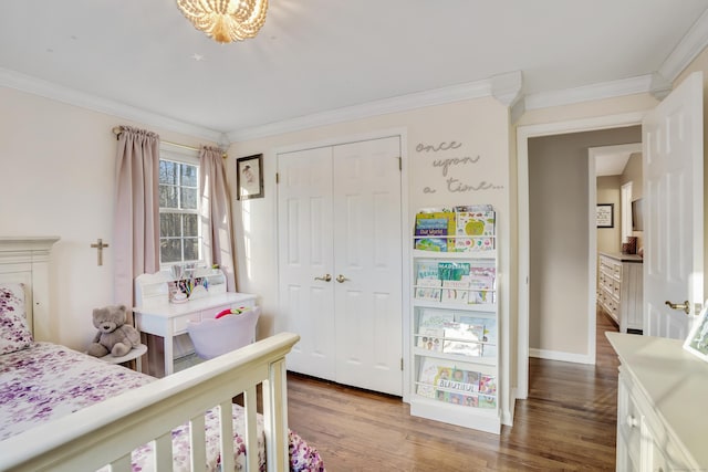 bedroom with a closet, ornamental molding, and hardwood / wood-style flooring