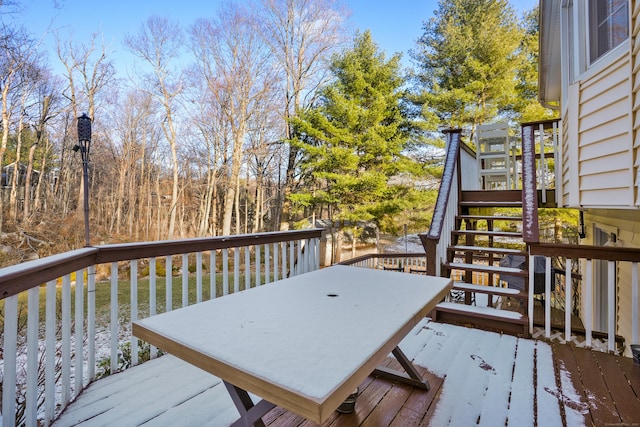 wooden deck featuring a water view