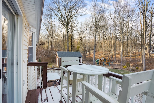 wooden deck featuring a storage unit