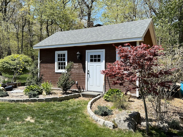 view of outdoor structure with a lawn