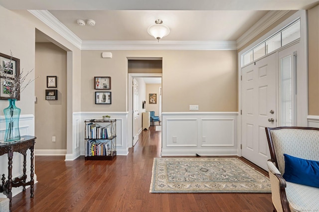 foyer entrance featuring dark hardwood / wood-style floors and ornamental molding